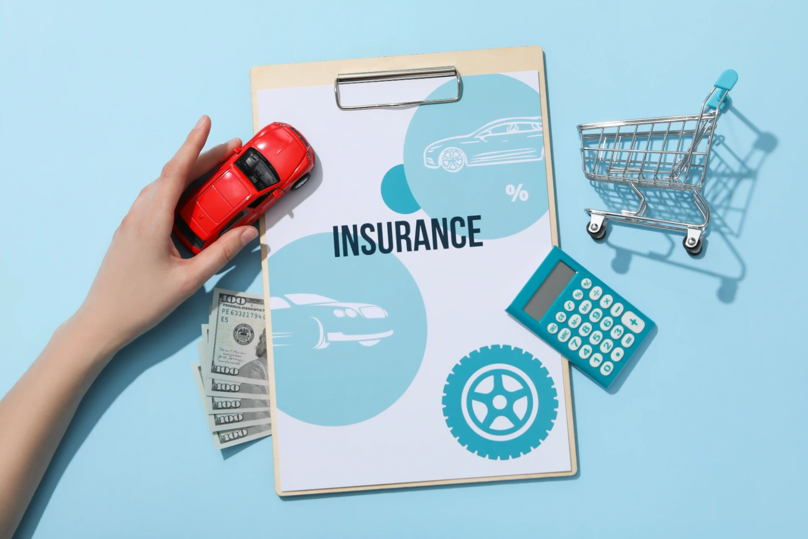 Car insurance comparison concept with a model car and calculator