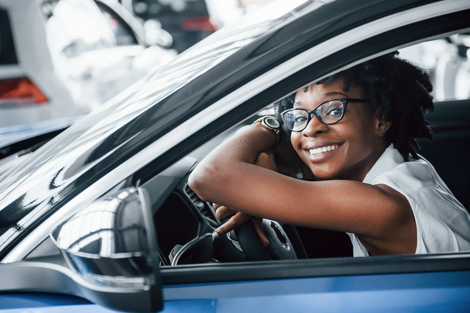 Driver reviewing a vehicle at a dealership